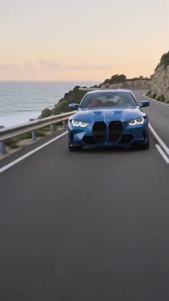 BMW car driving along a coastal road at sunset animation